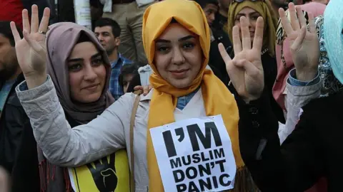 Getty Images Supporters of the Egyptian Muslim Brotherhood take part in a rally to protest against the death penalties for the members of the radical group in Egypt, outside the Egyptian embassy in Ankara on April 9, 201