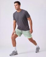Real Essentials 3 Pack: Men's 2 in 1 Mesh 7" Running Workout Gym Shorts with Compression Liner (Available in Big & Tall) - Image 3