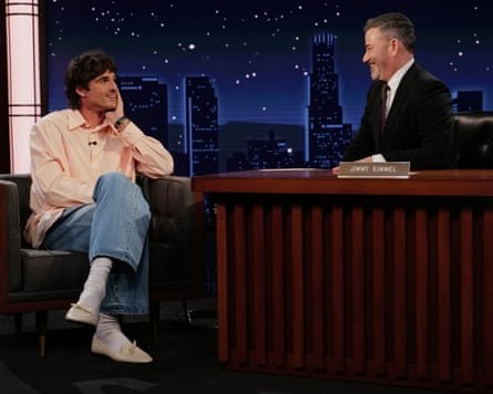 Jacob Elordi on Jimmy Kimmel wearing jeans, shirt and ballet flats.