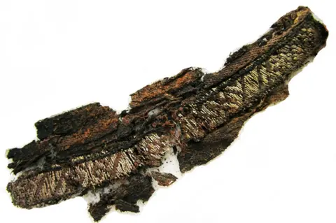BBC One of the excavated fragments made from fine silk and silver thread discovered at the two Swedish sites, Birka and Gamla Uppsala.