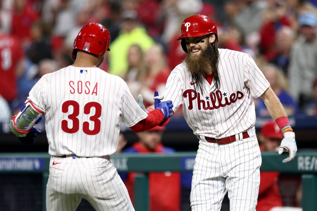 PHILADELPHIA, PENNSYLVANIA - SEPTEMBER 27: Edmundo Sosa #33 and Brandon Marsh #16 of the Philadelphia Phillies react following a solo home run hit by Sosa during the fifth inning against the Pittsburgh Pirates at Citizens Bank Park on September 27, 2023 in Philadelphia, Pennsylvania. (Photo by Tim Nwachukwu/Getty Images)