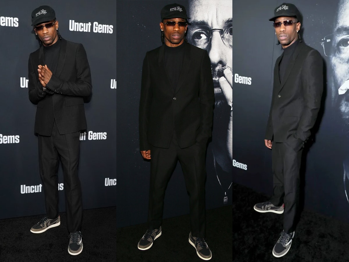 travis scott in black suit and sneakers for the premiere of uncut gems