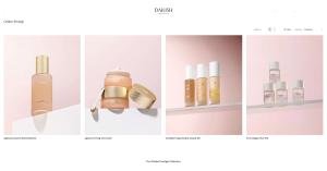 Four Dailish Golden Prestige Collection Korean skincare products on a pink background