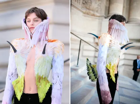 JB Lacroix/GC Images & WWD via Getty Images Emma Corrin attends the Schiaparelli Haute Couture Fall/Winter 2026/2027 show as part of Paris Fashion Week on July 6, 2026 in Paris, France.
