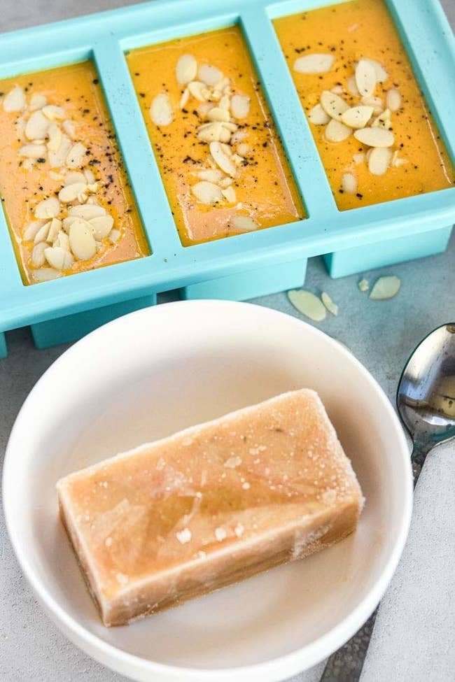 frozen rectangle of soup next to mold with soup in it