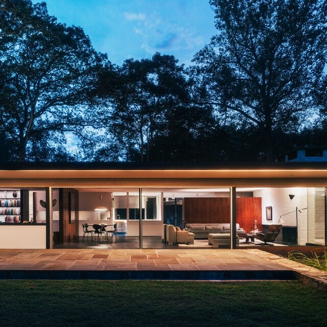 A view of the back of the Corwin house, designed by Richard Neutra in 1955 and recently restored by its new owners. On a riverside bluff in Connecticut, it features the architect’s signature “spider legs” supporting its 70-foot overhang, as well as a span of continuous light below that was part of Neutra’s original design but beyond the budget of the original owners, Betty and Henry Corwin.