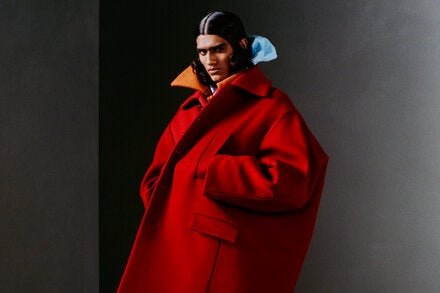 Balenciaga coat and coat (worn underneath), balenciaga.com; K-Way jacket, k-way.com; and stylist’s own tights.