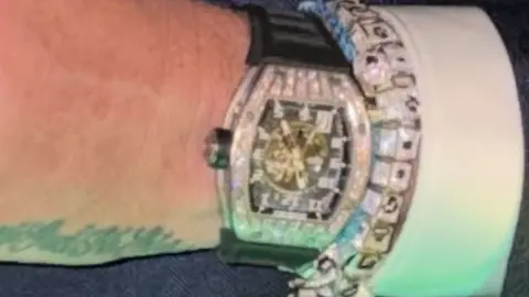 PA Media A close up picture of a diamond encrusted watch