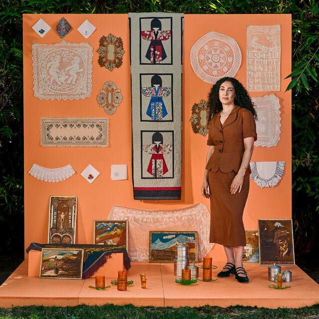 The musician Bedouine outside her house in Los Angeles with her collection of genealogical objects.