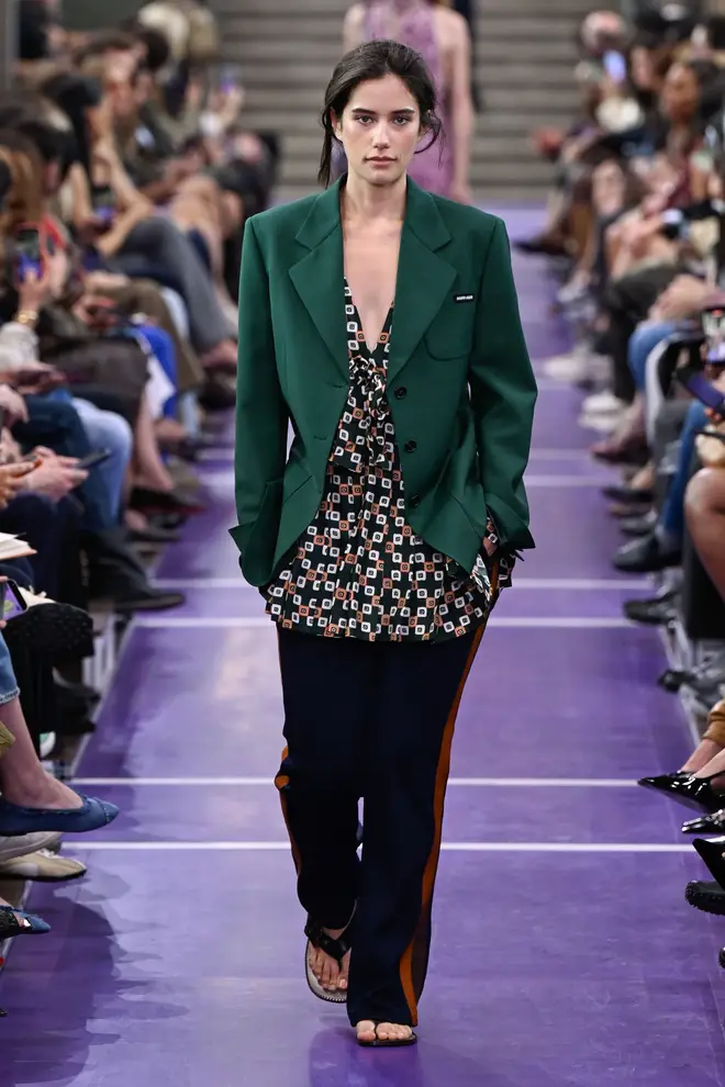 Ella Bleu Travolta has made her Paris Fashion Week runway debut, walking for Miu Miu during the brand’s Spring/Summer 2027 show on Sunday, 4 October.
